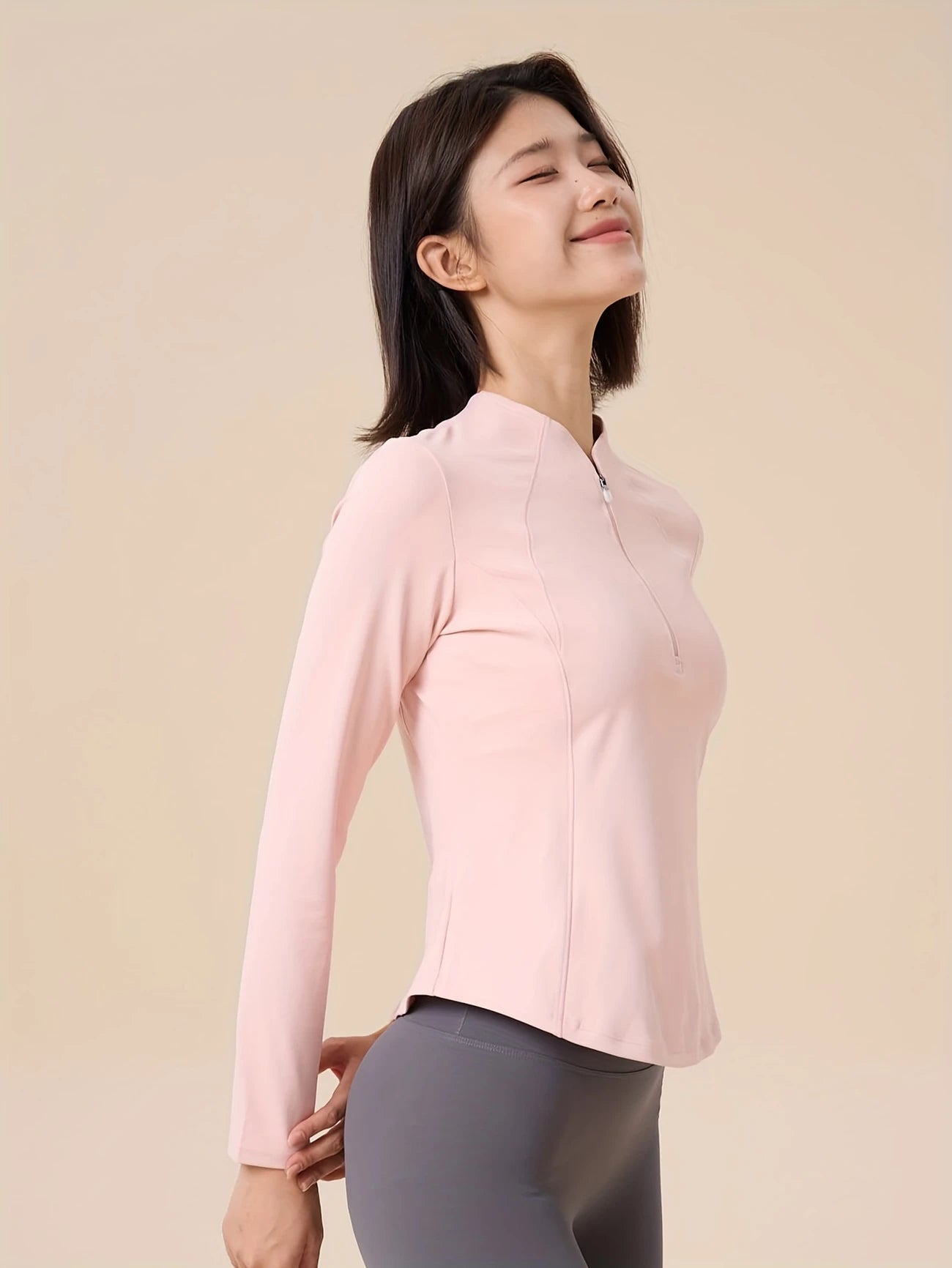 ハーフジップスリミングトップス