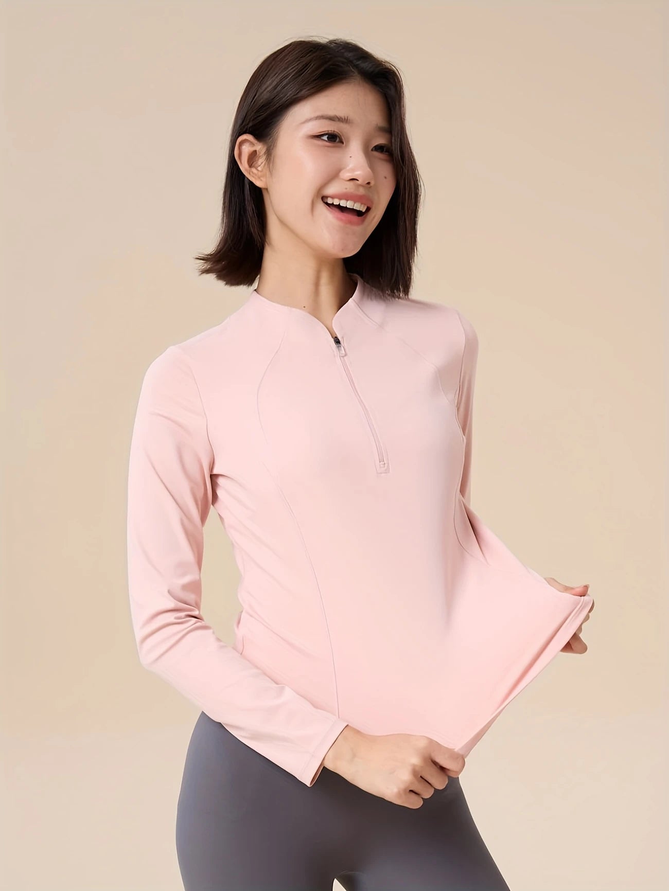 ハーフジップスリミングトップス